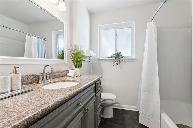 6909 Asher St, Metairie, LA 70003 - full bathroom with vanity, healthy amount of natural light, shower / bath combination with curtain, and tile patterned floors