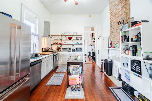352123 Cleveland Ave, New Orleans, LA 70119 - kitchen with appliances with stainless steel finishes, open shelves, a sink, dark wood finished floors, and light countertops