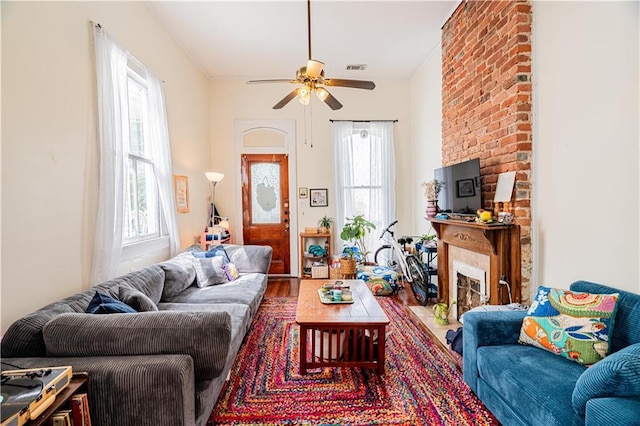 352123 Cleveland Ave, New Orleans, LA 70119 - living room featuring ceiling fan and a fireplace with flush hearth