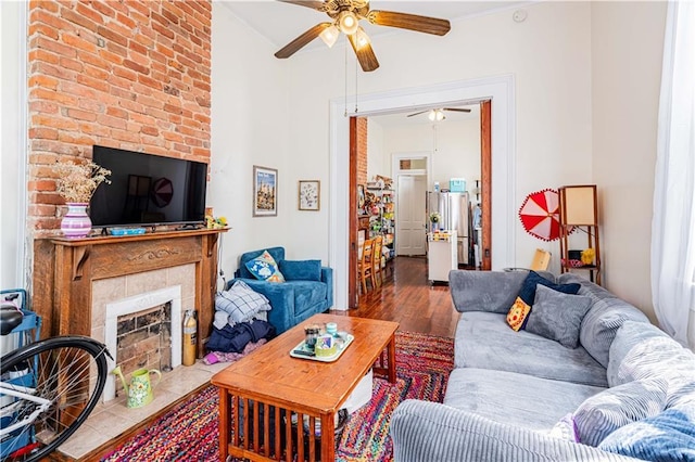352123 Cleveland Ave, New Orleans, LA 70119 - living room with a ceiling fan, wood finished floors, and a fireplace