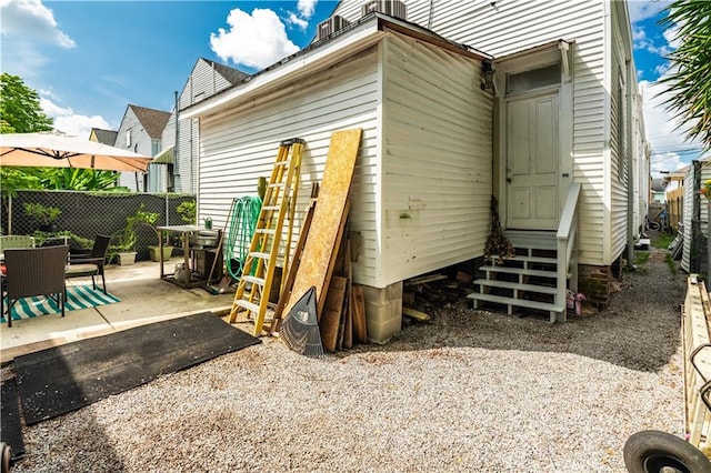 352123 Cleveland Ave, New Orleans, LA 70119 - back of house with entry steps, a patio, and outdoor dining area