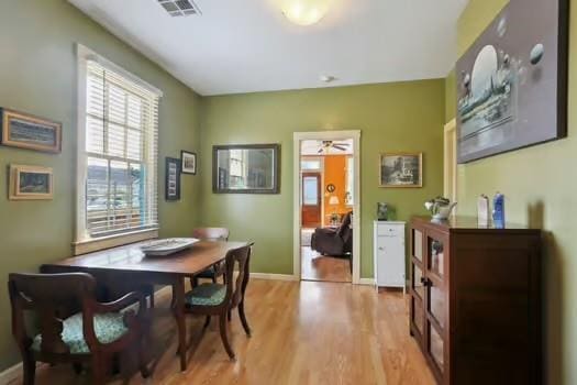 640 Lizardi St, New Orleans, LA 70117 - dining room with light wood finished floors and baseboards