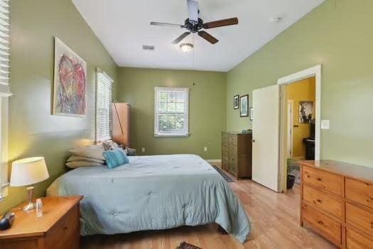 640 Lizardi St, New Orleans, LA 70117 - bedroom with light wood-style flooring and a ceiling fan