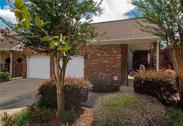 23783 Monarch Pt, Springfield, LA 70462 - view of front of home with brick siding, driveway, and roof with shingles