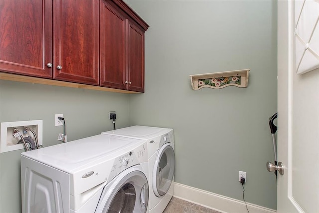 23783 Monarch Pt, Springfield, LA 70462 - washroom featuring cabinet space, separate washer and dryer, baseboards, and tile patterned flooring