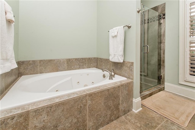 23783 Monarch Pt, Springfield, LA 70462 - full bath featuring a stall shower, a whirlpool tub, and tile patterned floors