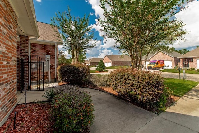 23783 Monarch Pt, Springfield, LA 70462 - view of yard featuring a residential view and concrete driveway