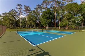 23783 Monarch Pt, Springfield, LA 70462 - view of tennis court featuring community basketball court and view of wooded area