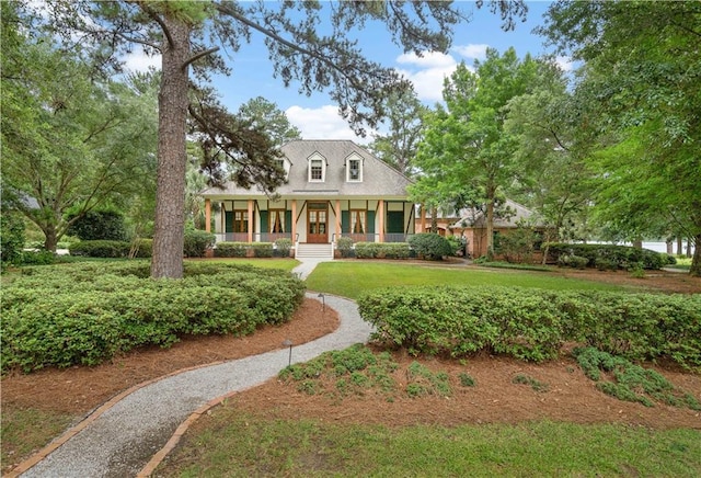 580 Northwoods Dr, Abita Springs, LA 70420 - new england style home with a porch and a front lawn