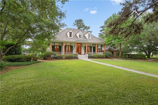 580 Northwoods Dr, Abita Springs, LA 70420 - view of front of property with covered porch and a front lawn