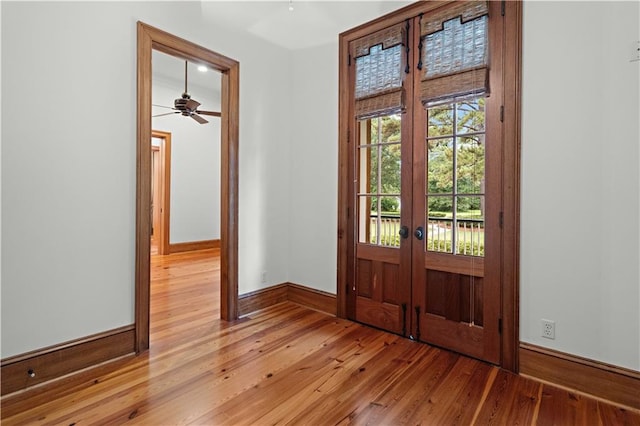 580 Northwoods Dr, Abita Springs, LA 70420 - entrance foyer with french doors, baseboards, and light wood-style flooring
