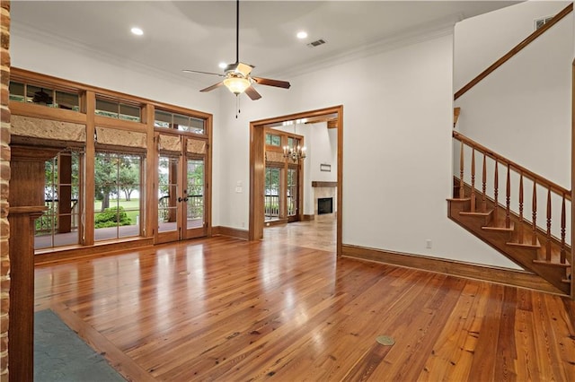 580 Northwoods Dr, Abita Springs, LA 70420 - unfurnished living room with french doors, ceiling fan, crown molding, wood-type flooring, and recessed lighting