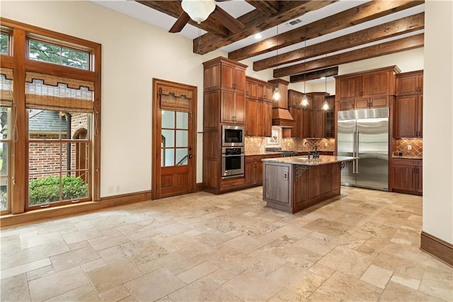 580 Northwoods Dr, Abita Springs, LA 70420 - kitchen featuring built in appliances, ceiling fan, backsplash, beamed ceiling, and baseboards