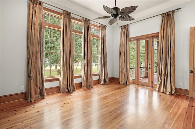 580 Northwoods Dr, Abita Springs, LA 70420 - unfurnished room with baseboards, light wood-type flooring, french doors, ceiling fan, and crown molding