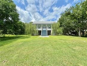 110 Mulberry Ave, Mandeville, LA 70448 - back of property with a yard