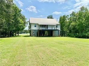 110 Mulberry Ave, Mandeville, LA 70448 - rear view of property with a lawn