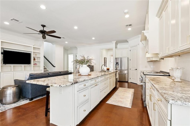 1516 Huron Ave, Metairie, LA 70005 - kitchen with appliances with stainless steel finishes, crown molding, a ceiling fan, white cabinetry, and recessed lighting