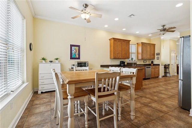 6661 Colbert St, New Orleans, LA 70124 - dining area with ceiling fan, ornamental molding, recessed lighting, and tile patterned flooring