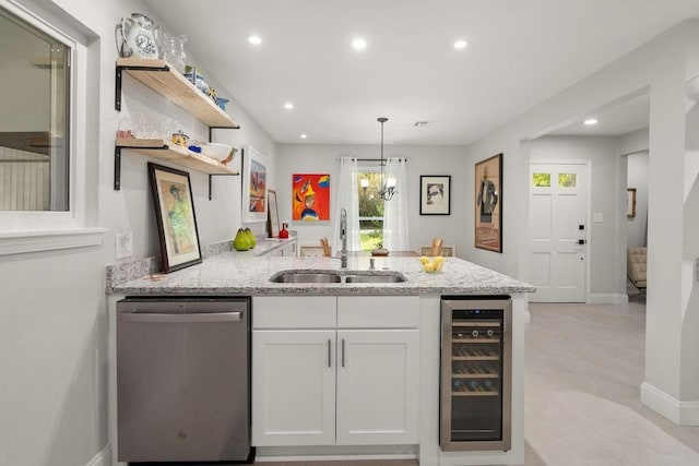 1012 W 11th Ave, Covington, LA 70433 - kitchen with dishwasher, open shelves, beverage cooler, a sink, and a peninsula