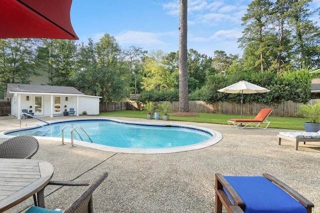 1012 W 11th Ave, Covington, LA 70433 - view of pool featuring a patio, an outdoor structure, view of scattered trees, and a storage structure