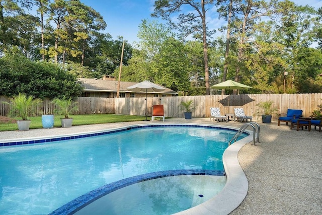 1012 W 11th Ave, Covington, LA 70433 - view of pool with a fenced backyard, a pool with connected hot tub, a patio, and view of scattered trees