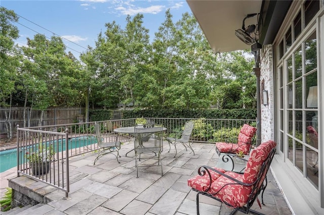 43 Farnham Pl, Metairie, LA 70005 - fenced backyard with a patio, outdoor dining space, and view of wooded area