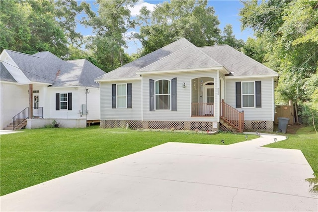 28628 Violet St, Lacombe, LA 70445 - view of front facade with a front yard and roof with shingles