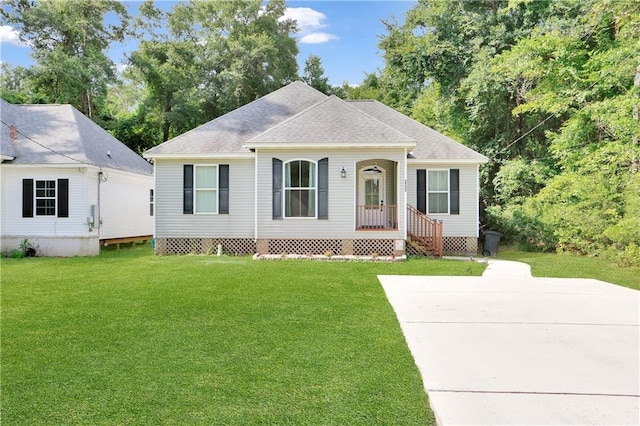 28628 Violet St, Lacombe, LA 70445 - view of front of home featuring a front lawn and roof with shingles