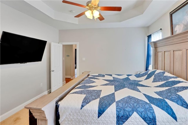 28628 Violet St, Lacombe, LA 70445 - bedroom featuring a tray ceiling, ceiling fan, and baseboards