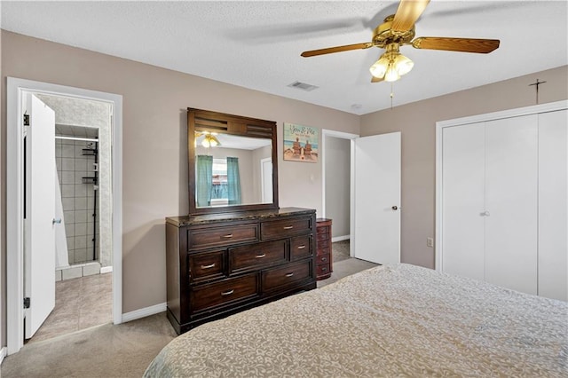 3140 Arbutus Ln, Marrero, LA 70072 - bedroom with carpet, baseboards, connected bathroom, a closet, and ceiling fan
