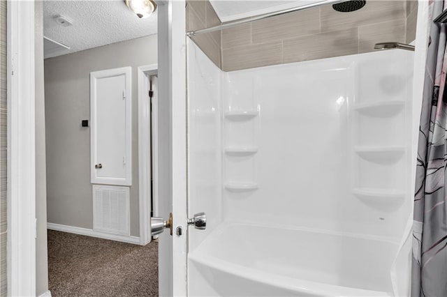 3140 Arbutus Ln, Marrero, LA 70072 - full bathroom featuring shower / bath combination with curtain, baseboards, and a textured ceiling