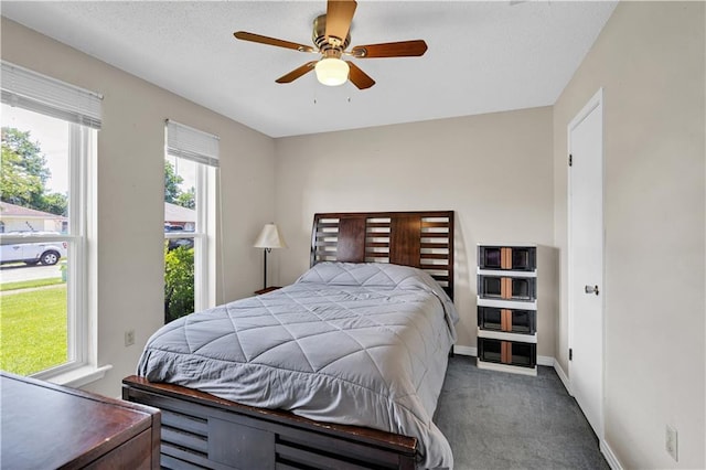 3140 Arbutus Ln, Marrero, LA 70072 - bedroom with carpet floors, multiple windows, baseboards, and a ceiling fan