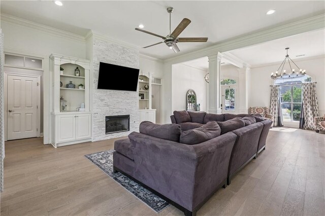 108 Parkview Dr, La Place, LA 70068 - living area featuring light wood finished floors, ceiling fan, crown molding, a stone fireplace, and recessed lighting
