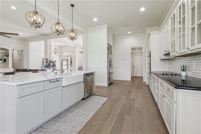 108 Parkview Dr, La Place, LA 70068 - kitchen with a chandelier, appliances with stainless steel finishes, a sink, open floor plan, and ornamental molding
