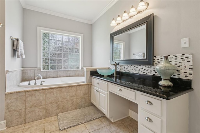 108 Parkview Dr, La Place, LA 70068 - full bath with vanity, a garden tub, tile patterned flooring, crown molding, and decorative backsplash