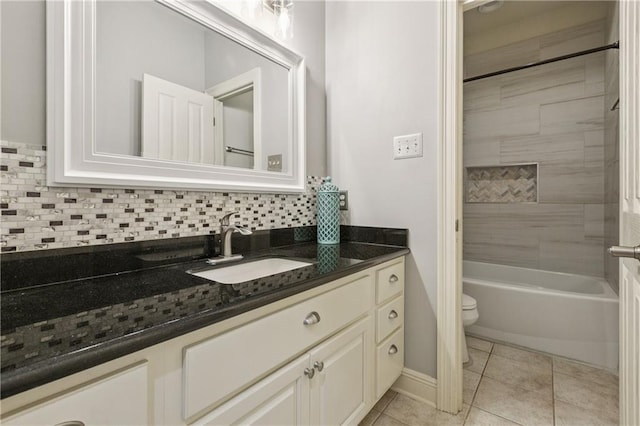 108 Parkview Dr, La Place, LA 70068 - bathroom with toilet, vanity, tile patterned floors, backsplash, and  shower combination