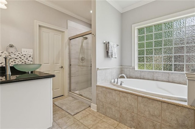 108 Parkview Dr, La Place, LA 70068 - bathroom with a bath, a shower stall, tile patterned flooring, crown molding, and vanity