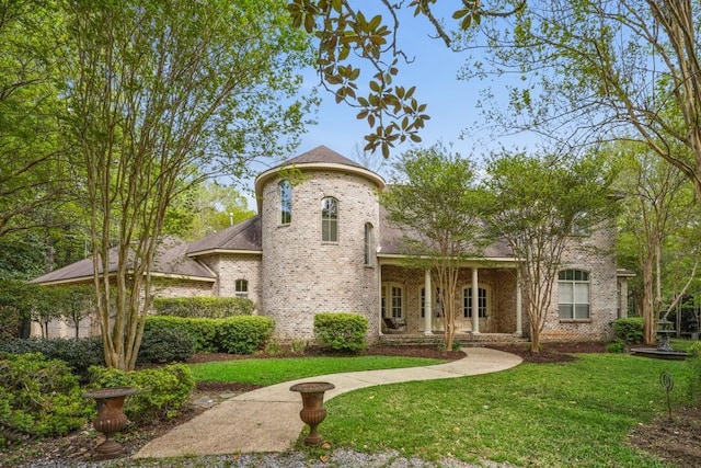 20 Beechwood Gardens Ln, Covington, LA 70435 - view of front of house featuring brick siding, a front lawn, and a porch
