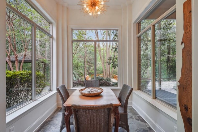 20 Beechwood Gardens Ln, Covington, LA 70435 - sunroom featuring healthy amount of natural light, baseboards, ornamental molding, and a chandelier