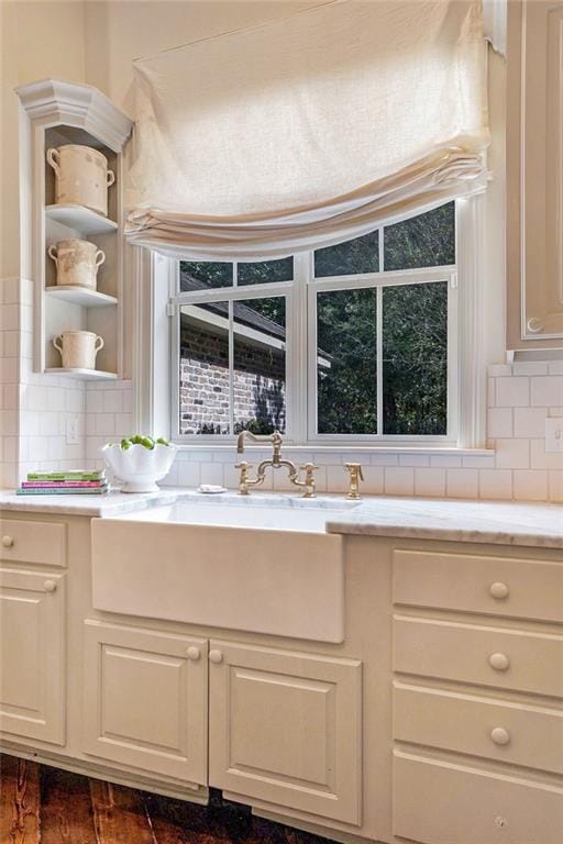 20 Beechwood Gardens Ln, Covington, LA 70435 - kitchen featuring decorative backsplash, light countertops, a sink, and open shelves