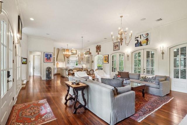 20 Beechwood Gardens Ln, Covington, LA 70435 - living room featuring a chandelier, french doors, plenty of natural light, and ornamental molding