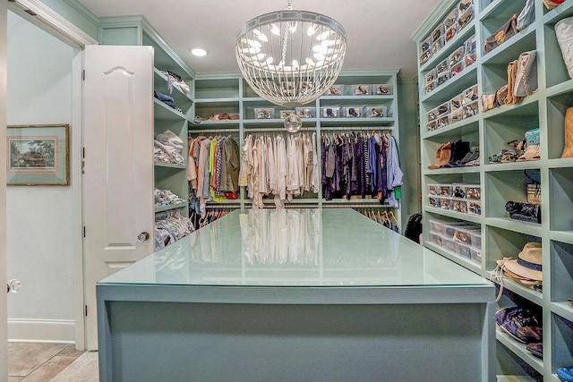 20 Beechwood Gardens Ln, Covington, LA 70435 - walk in closet featuring a chandelier and tile patterned flooring