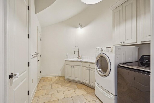 20 Beechwood Gardens Ln, Covington, LA 70435 - washroom featuring separate washer and dryer, cabinet space, and baseboards