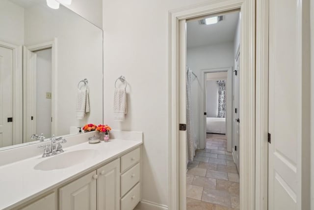 20 Beechwood Gardens Ln, Covington, LA 70435 - bathroom with vanity, baseboards, and stone finish flooring