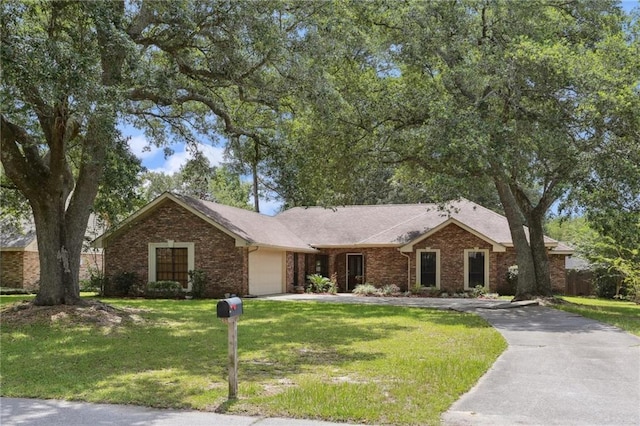 111 Thatcher Dr, Slidell, LA 70461 - single story home featuring brick siding, a garage, and asphalt driveway