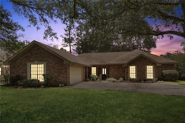 111 Thatcher Dr, Slidell, LA 70461 - ranch-style home with asphalt driveway, a garage, brick siding, and a front yard