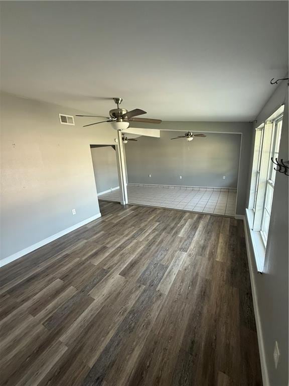 245 W Tish Dr, Avondale, LA 70094 - unfurnished room featuring dark wood-style floors, a ceiling fan, and baseboards