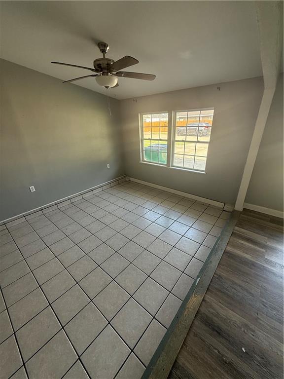 245 W Tish Dr, Avondale, LA 70094 - spare room featuring a ceiling fan, baseboards, and tile patterned floors