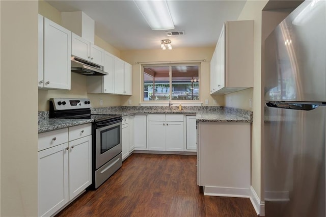 472 Cumberland Dr, Slidell, LA 70458 - kitchen featuring stainless steel appliances, under cabinet range hood, a sink, dark wood-type flooring, and light stone countertops