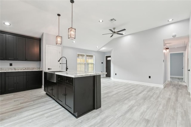 1938 W Homestead Dr, New Orleans, LA 70114 - kitchen with a sink, ceiling fan, lofted ceiling, open floor plan, and light wood-style floors